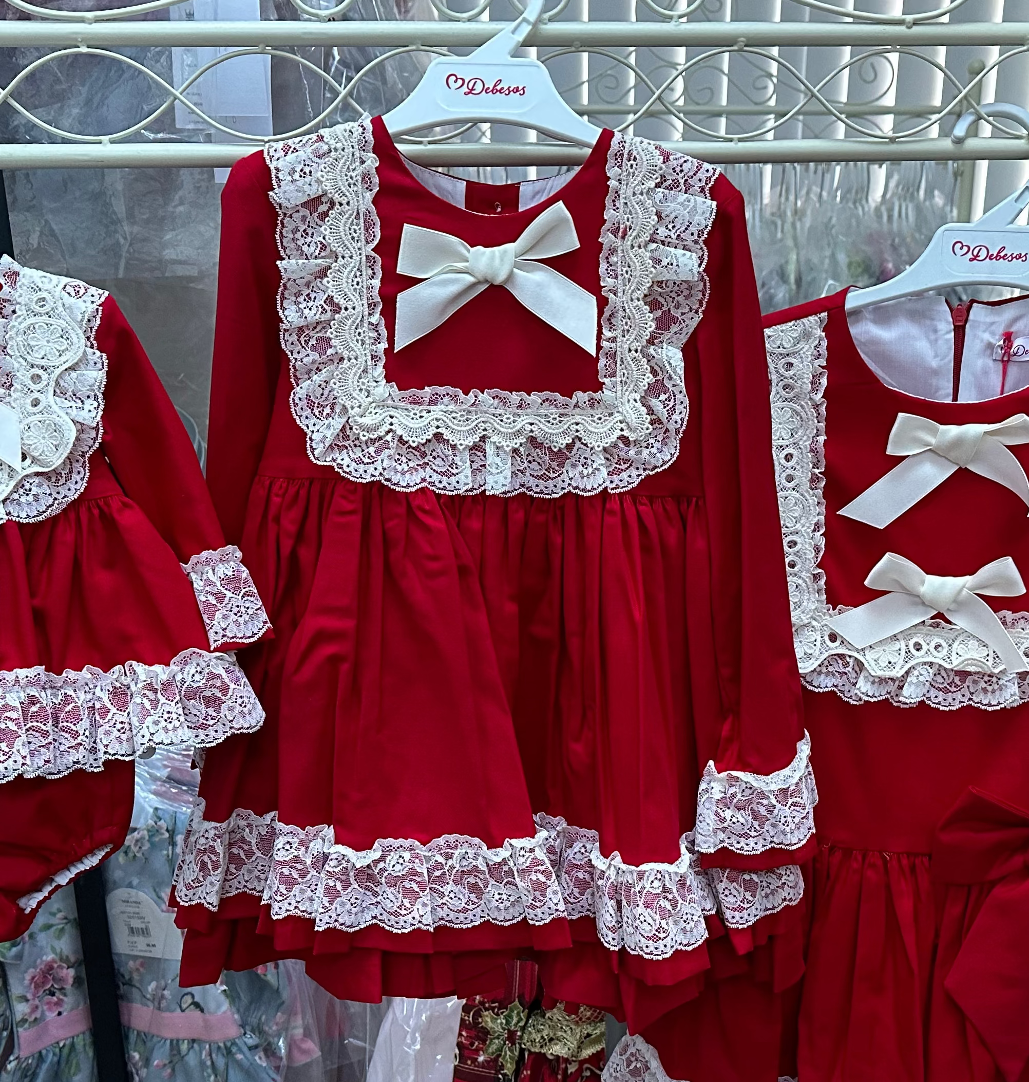 Girls red and cream dress by Debesos. Perfect for Christmas.