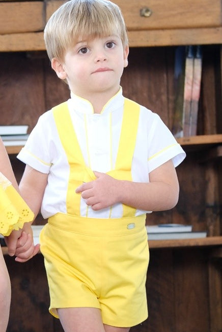 Boy wearing yellow H-bar shorts set with cream shirt by Sonata Infantil, Spanish children's outfit UK