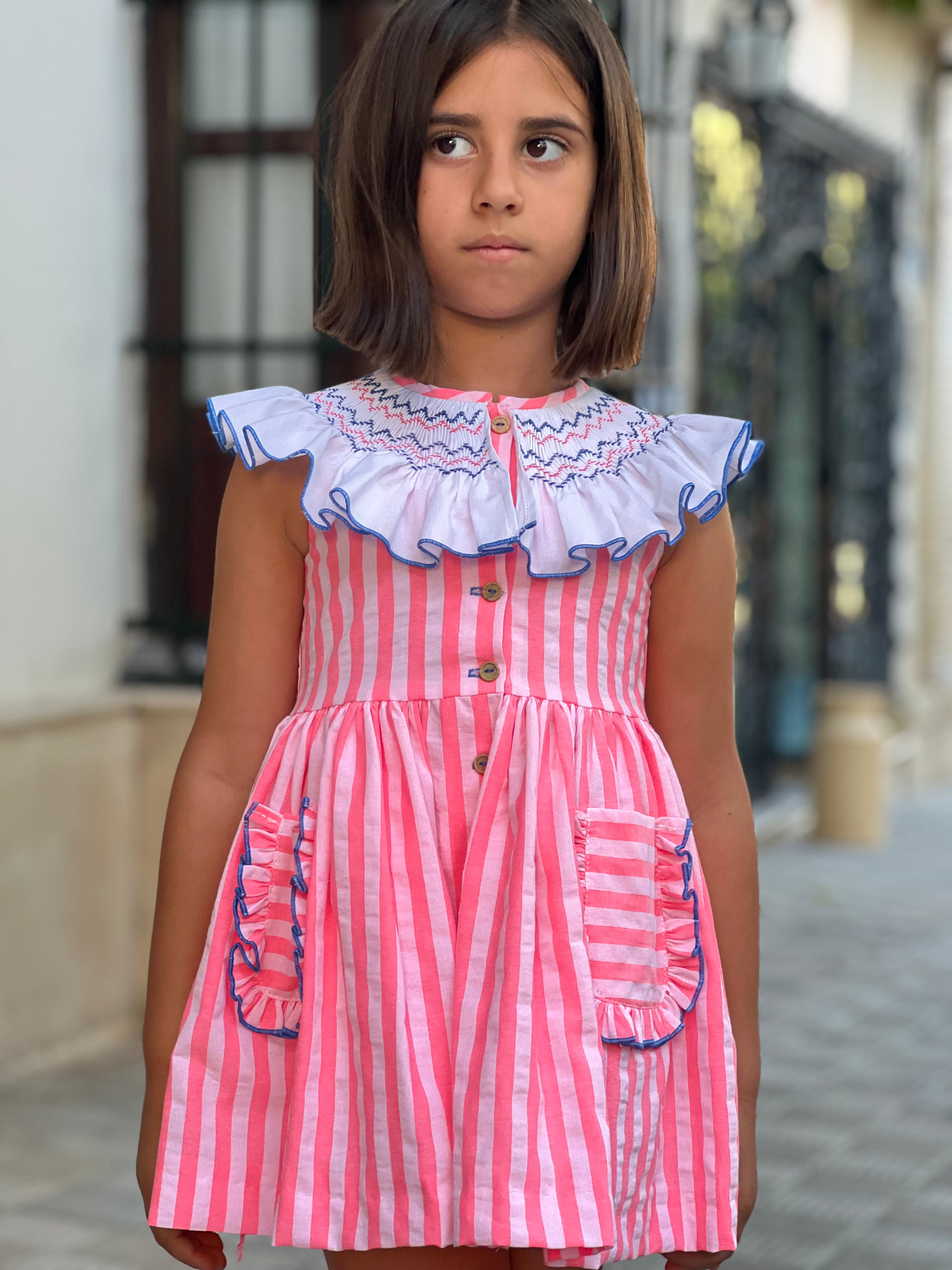 La Peppa SS26 Baby Girl's Neon Pink Striped Dress with Smocked Collar Detail.