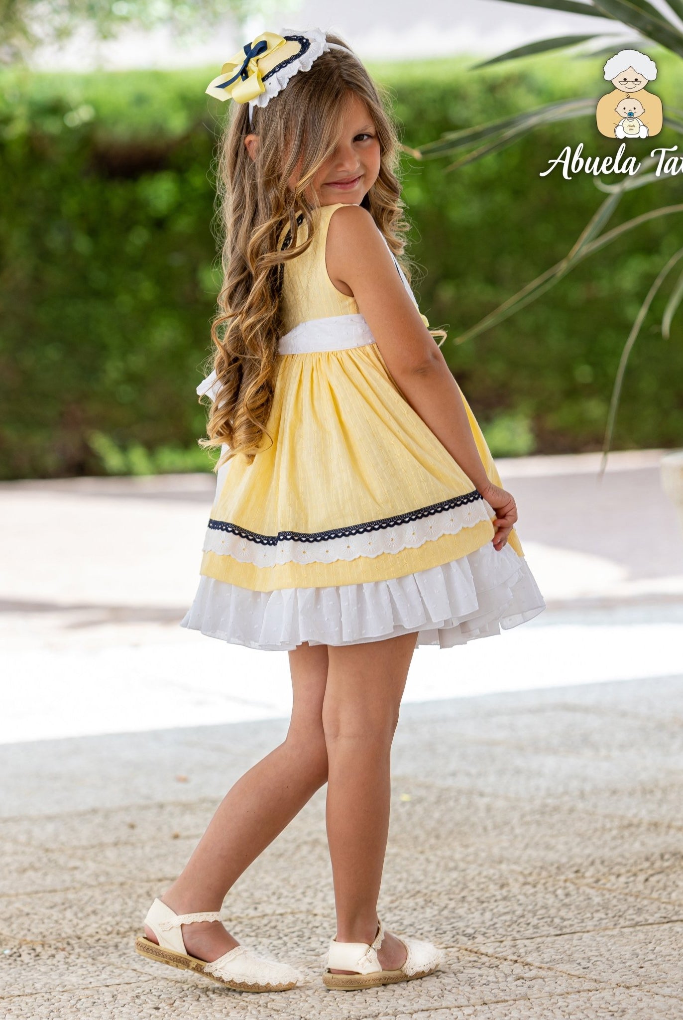 Girls Spanish yellow summer dress with navy trim and headpiece