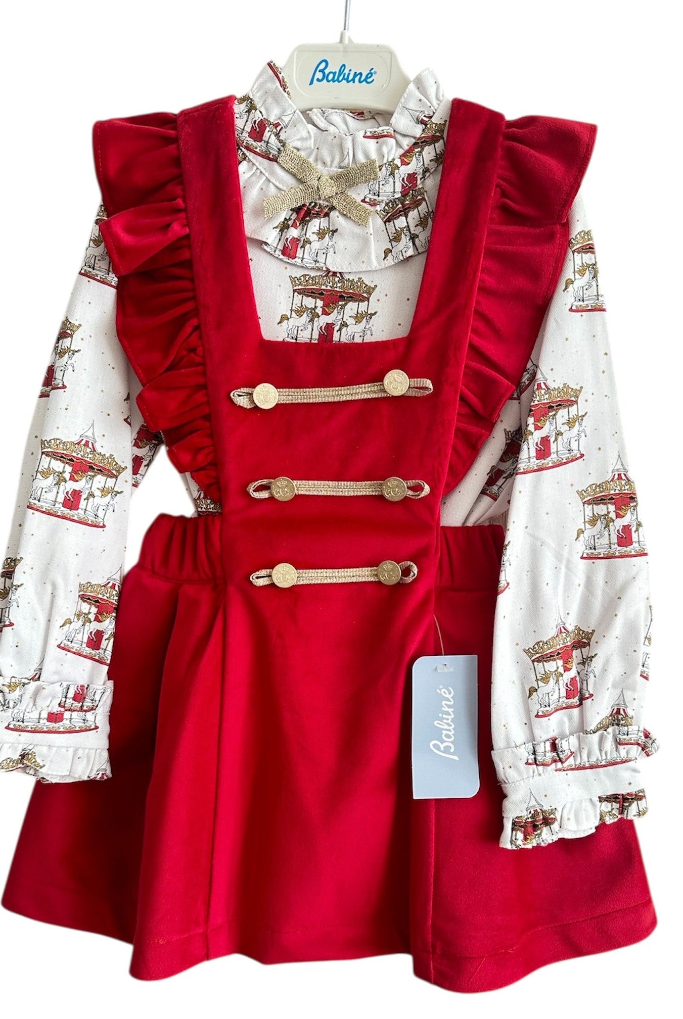 Perfect for Christmas girls red velvet pinafore dress with gold detailing and matching christmas print carousel blouse.