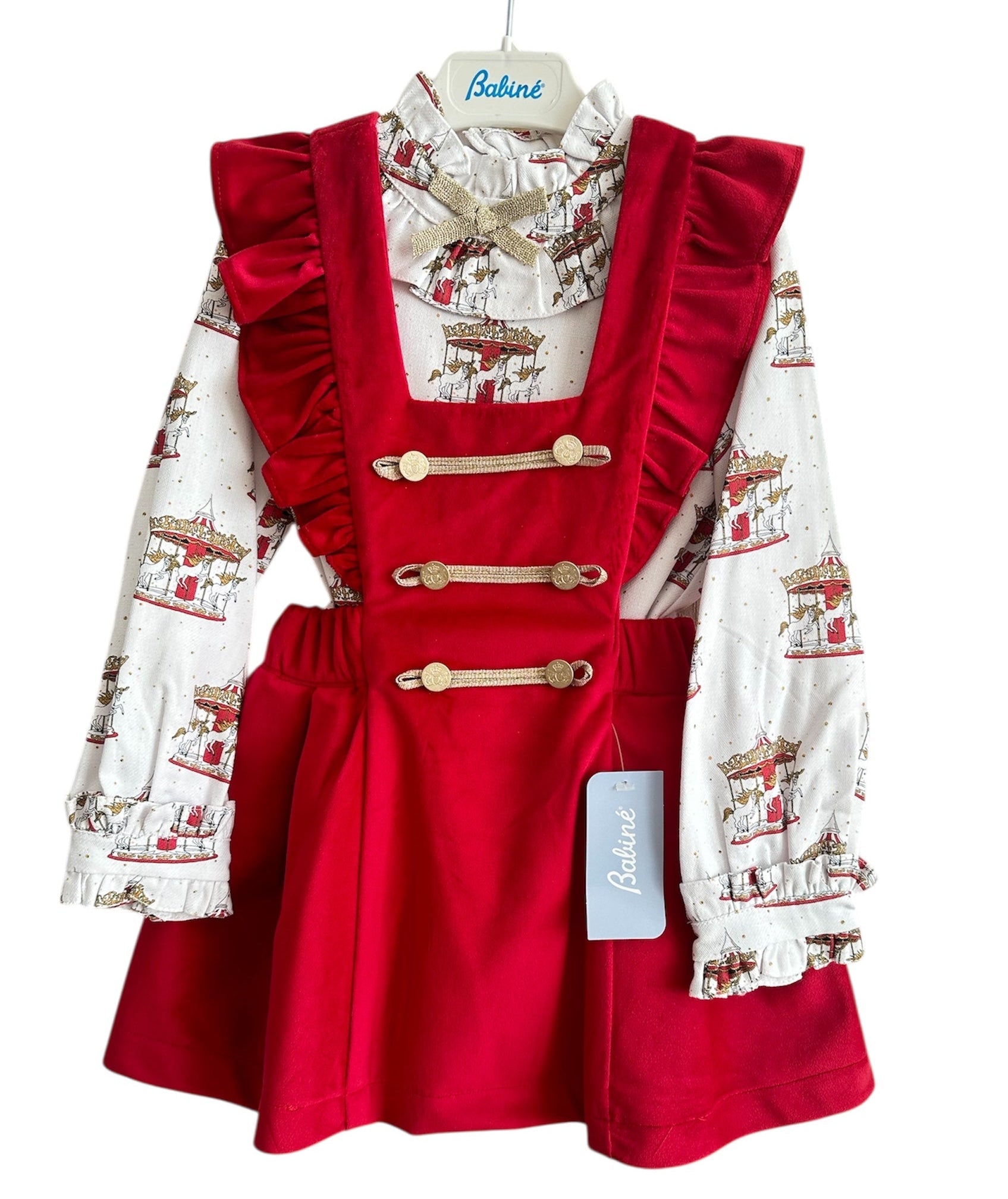 Perfect for Christmas girls red velvet pinafore dress with gold detailing and matching christmas print carousel blouse.