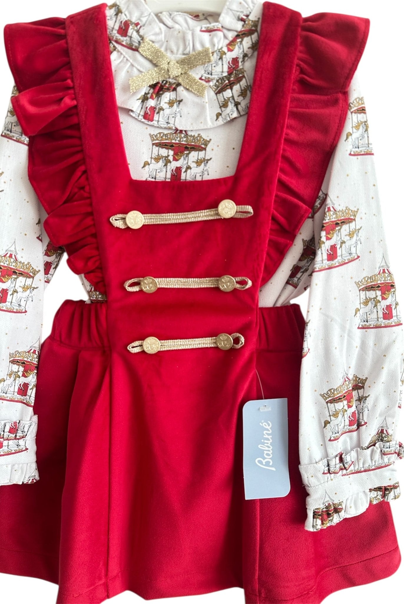 Perfect for Christmas girls red velvet pinafore dress with gold detailing and matching christmas print carousel blouse.