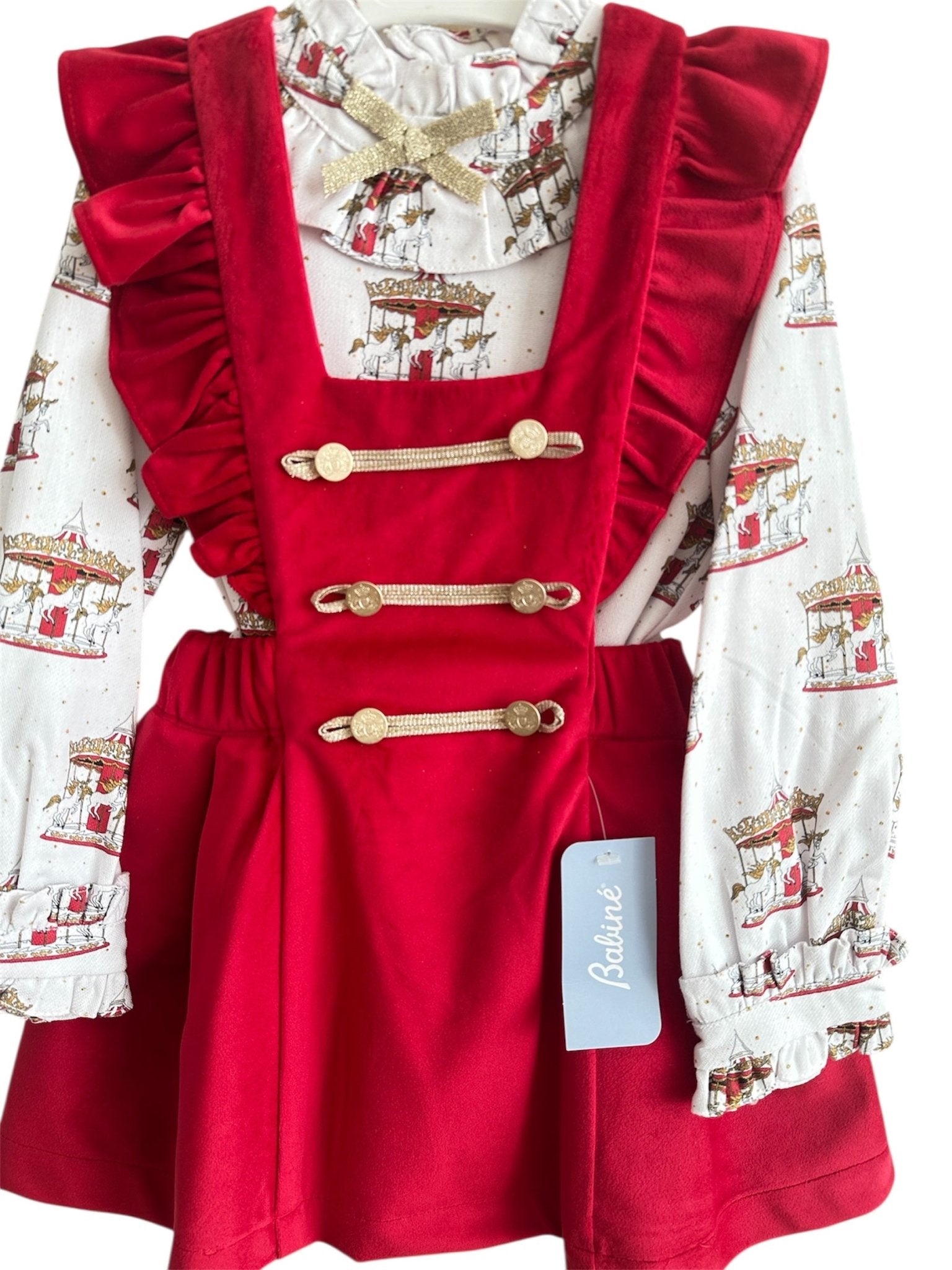 Perfect for Christmas girls red velvet pinafore dress with gold detailing and matching christmas print carousel blouse.