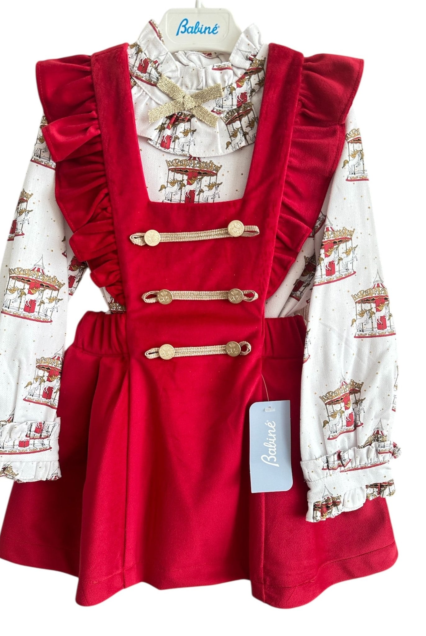 Perfect for Christmas girls red velvet pinafore dress with gold detailing and matching christmas print carousel blouse.