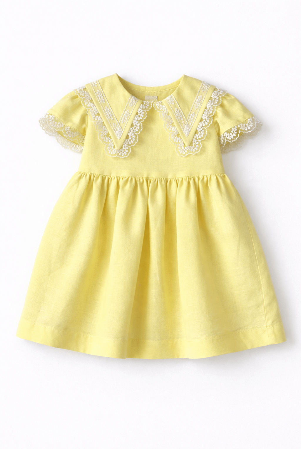Basmarti SS26 baby girls yellow lace dress in linen and cotton, Spanish children's wear Easter and summer outfit for babies 6–24 months.