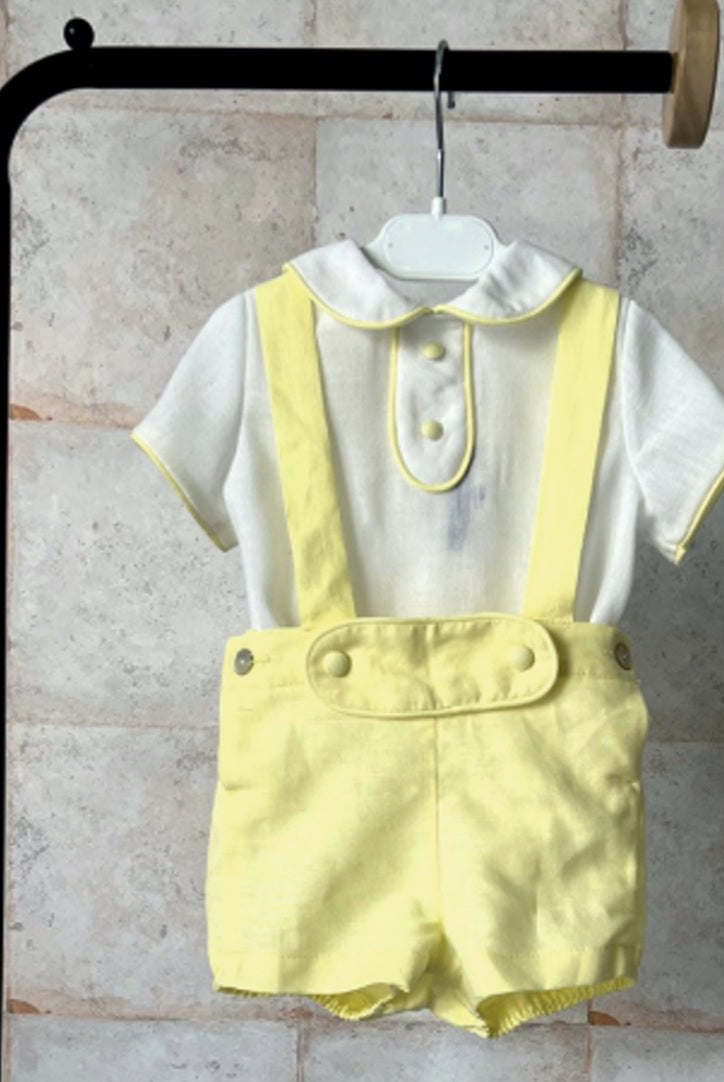 Basmarti SS26 baby boys Spanish outfit with white Peter Pan collar shirt and lemon yellow suspender shorts, traditional summer set for babies 3–48 months.