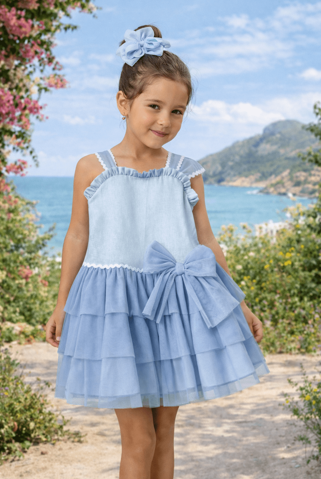 Girl wearing Basmarti Camelia blue Spanish occasion dress outdoors