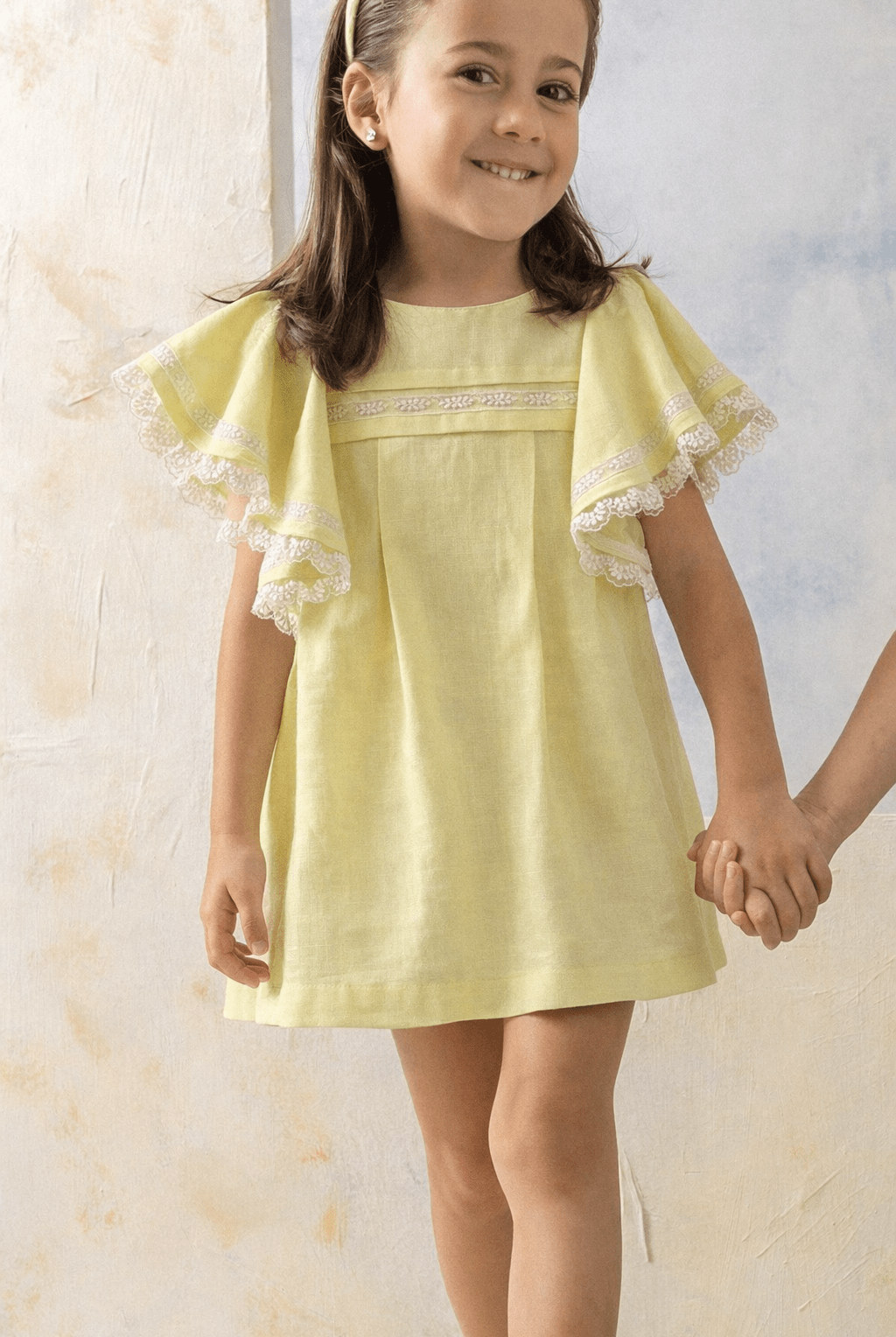 Basmarti girls lemon yellow dress with lace flutter sleeves, Spanish linen cotton summer dress for girls aged 3–10 years.