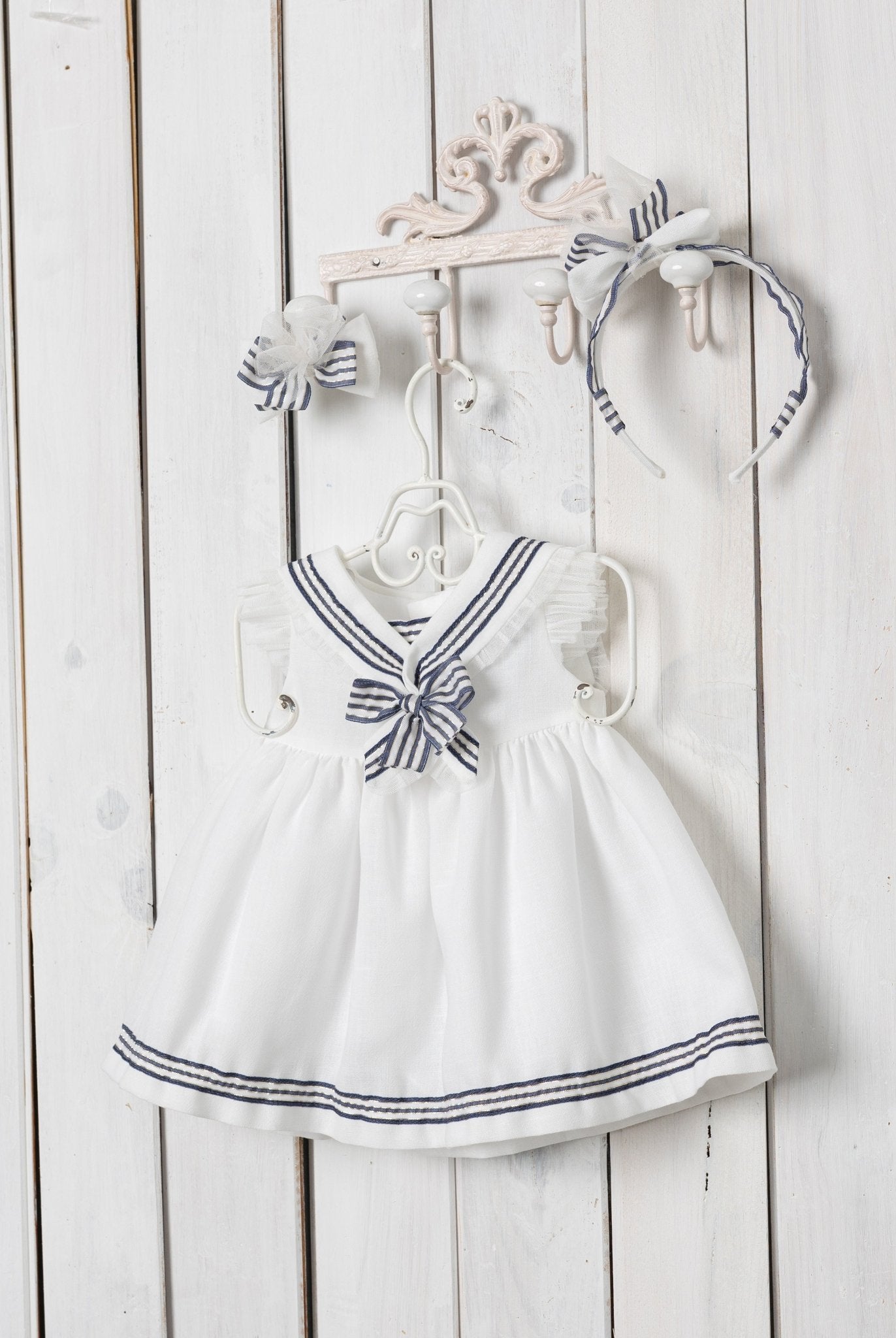 White sailor collar with navy trim on Basmarti baby dress