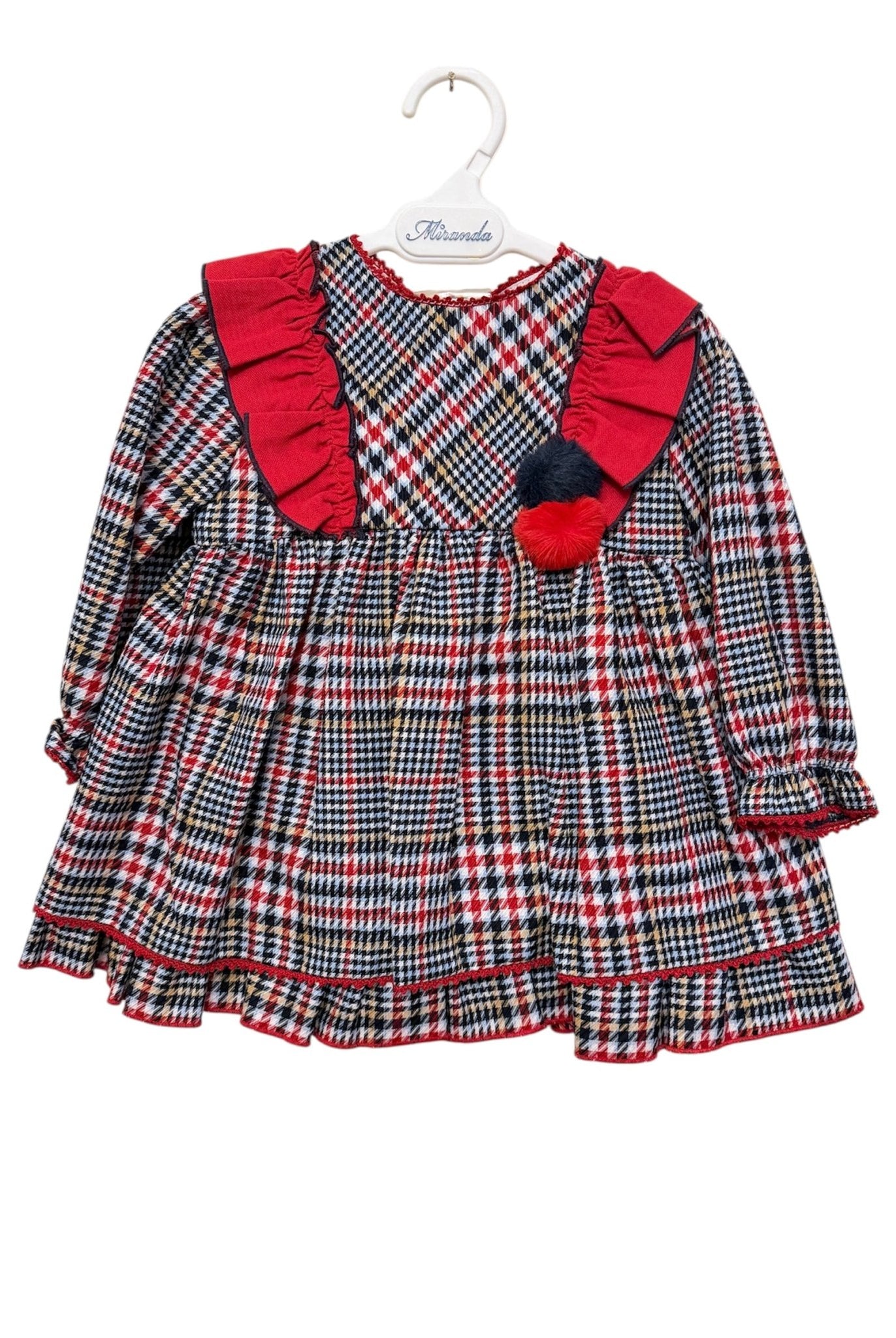 Plaid baby dress with red accents on a white background