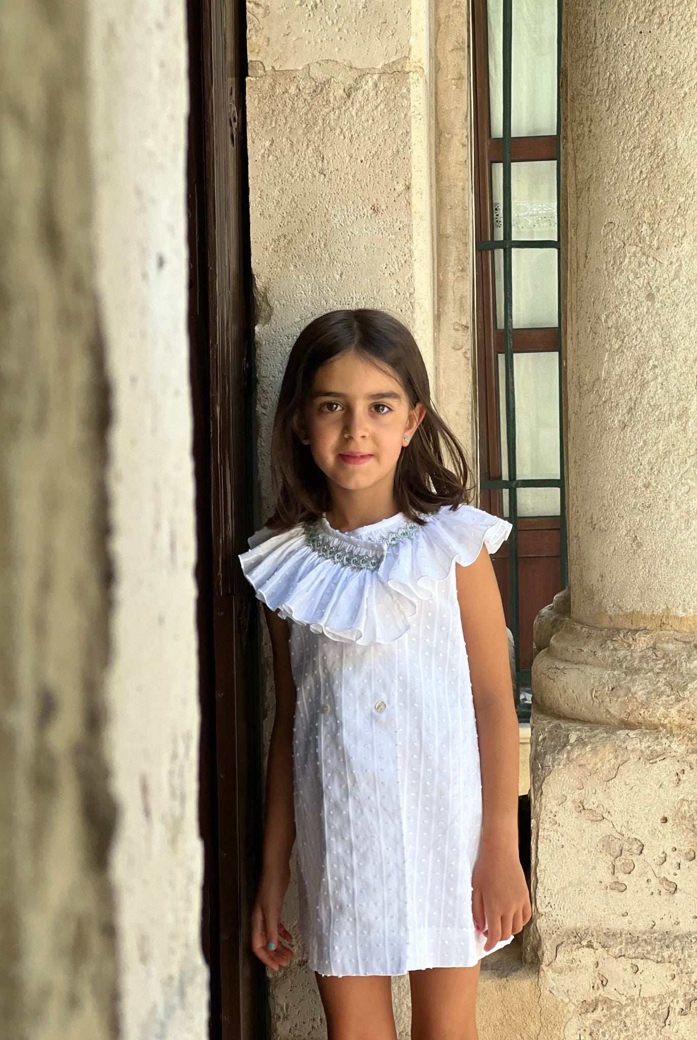 El Copo SS26 Girls White Dress with Ruffle Smocked Collar Detail.