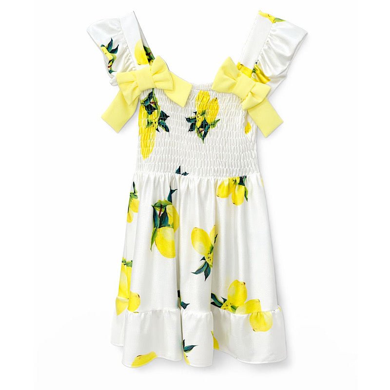 Girls lemon print smocked summer dress with yellow bow shoulders.