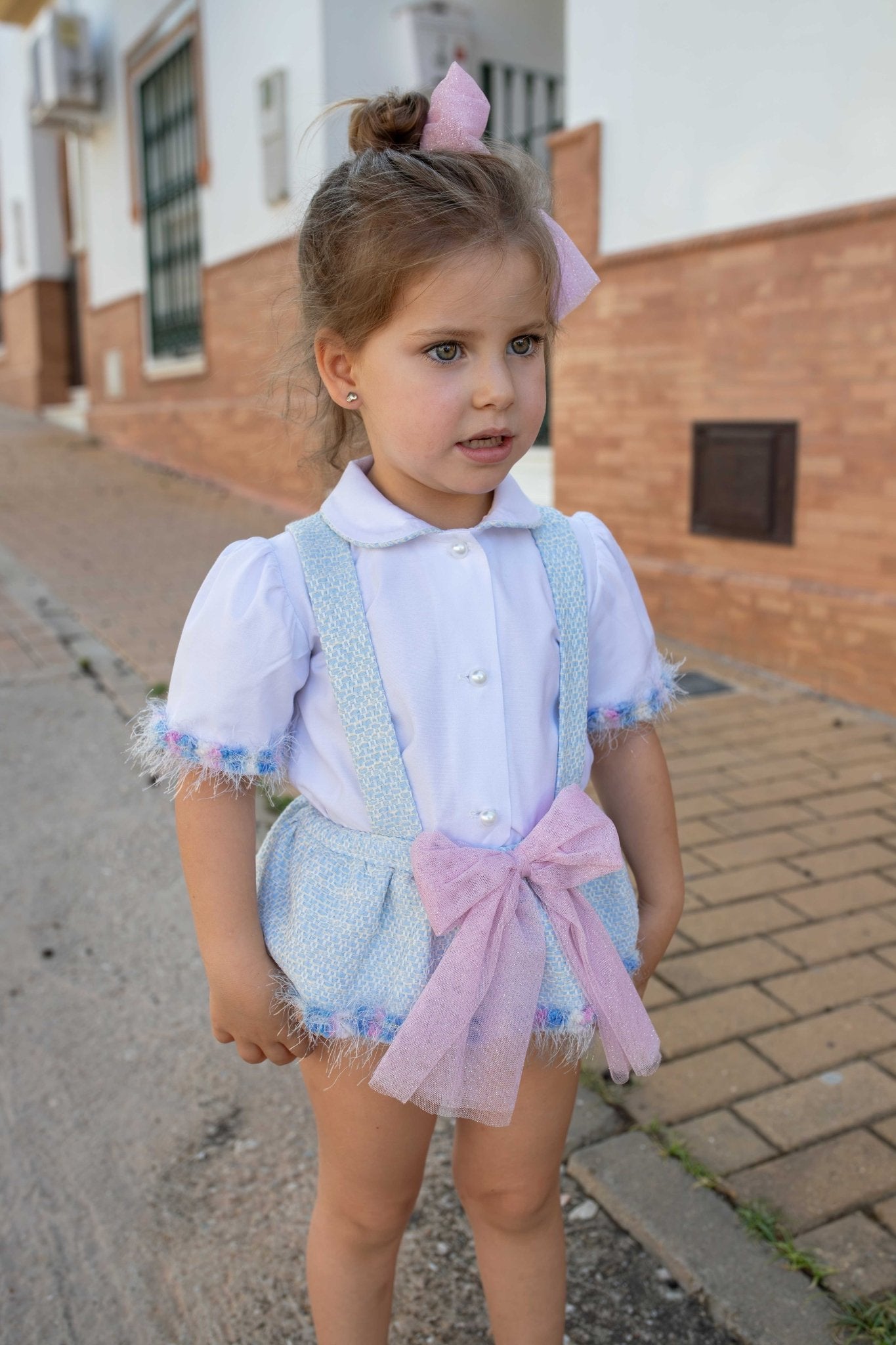 Naxos SS26 baby girls blue tweed suspender shorts with pink bow and white blouse outfit