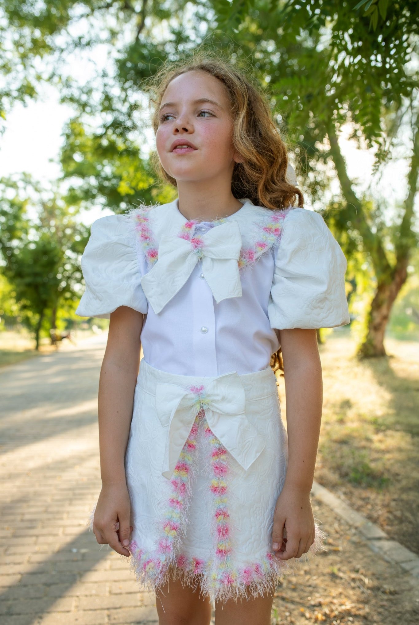 Naxos SS26 - Girls White Jacquard & Multicolour Skirt and Blouse Set