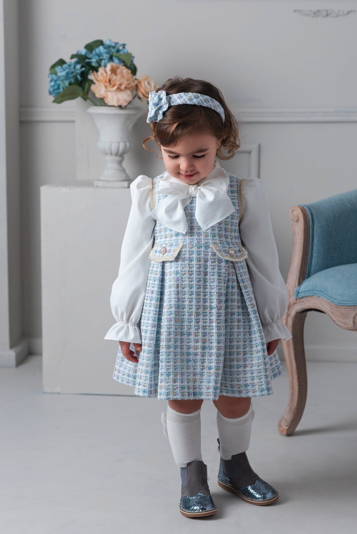 Young girl wearing Rochy AW25 Chanel Blue Tweed Dress