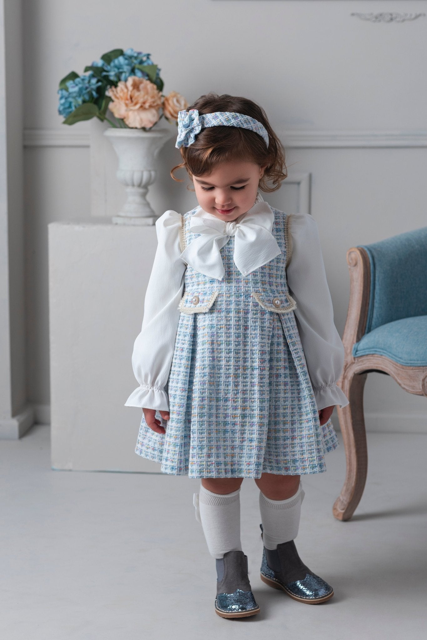 Young girl wearing Rochy AW25 Chanel Blue Tweed Dress