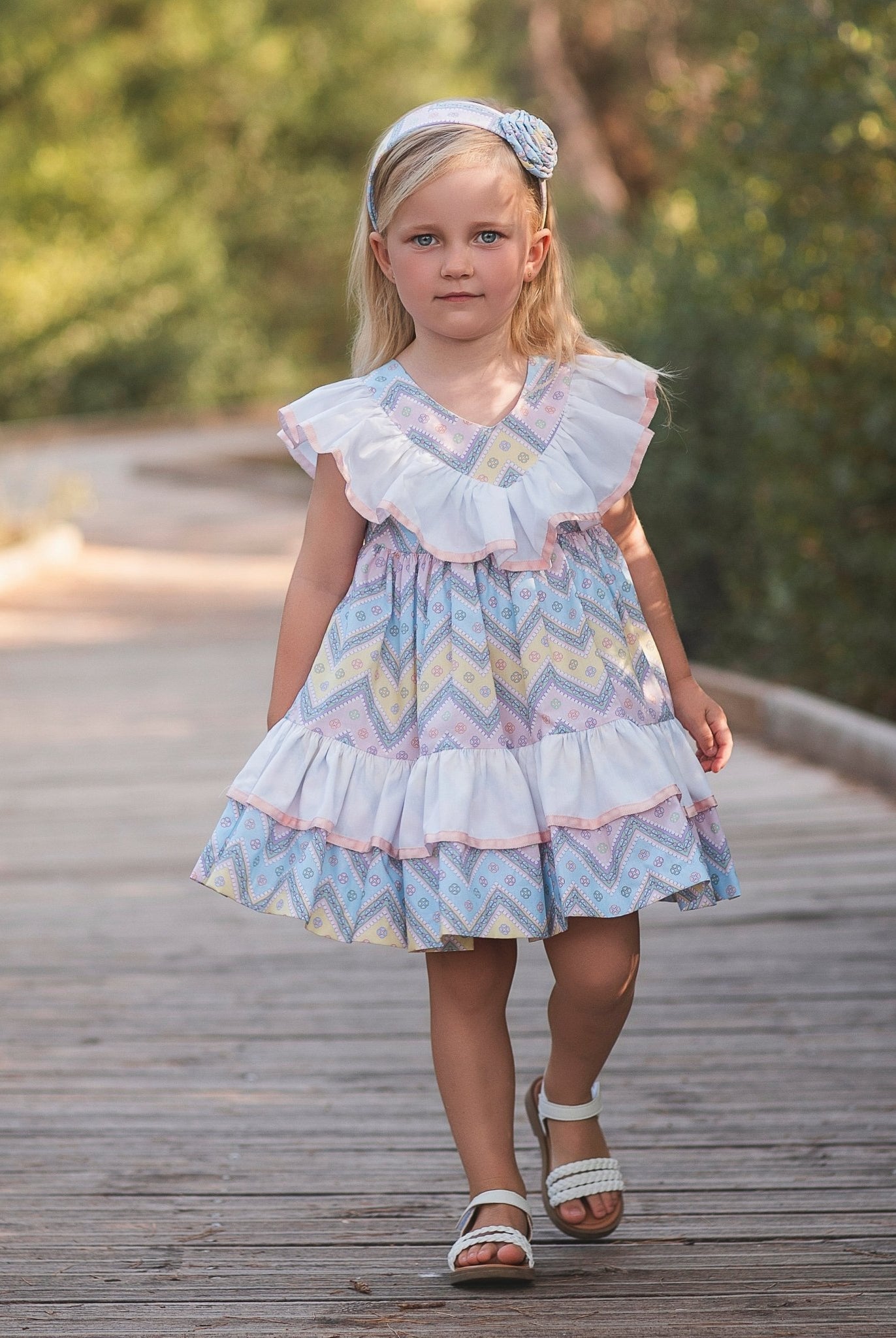 Girl wearing Rochy SS26 Multi Coloured pastel Zig Zag dress