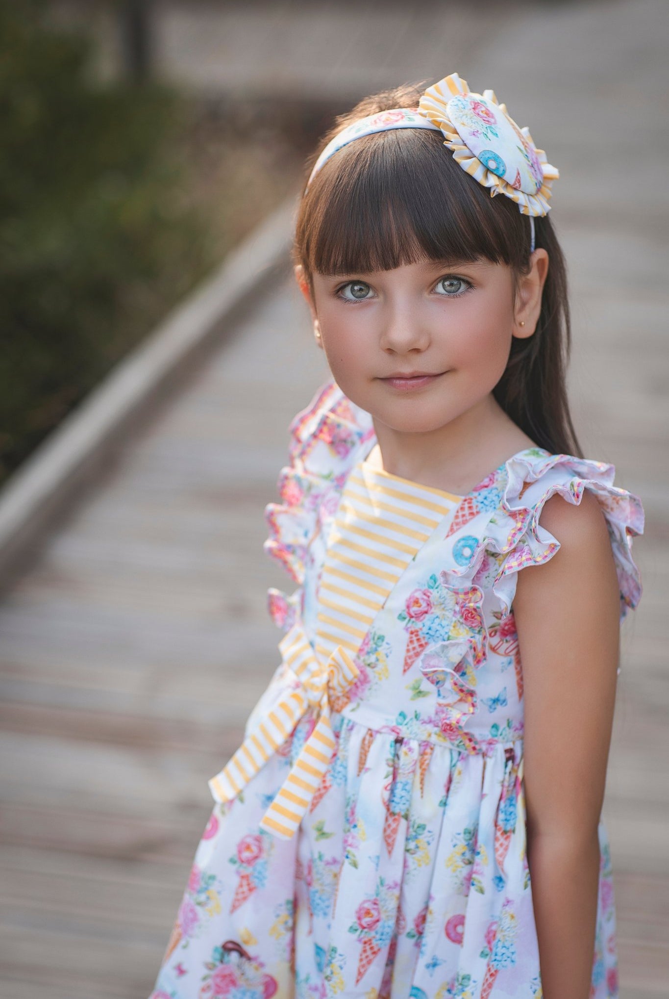 Young girl in Rochy SS26 Sweet Colletion Multicolour dress.