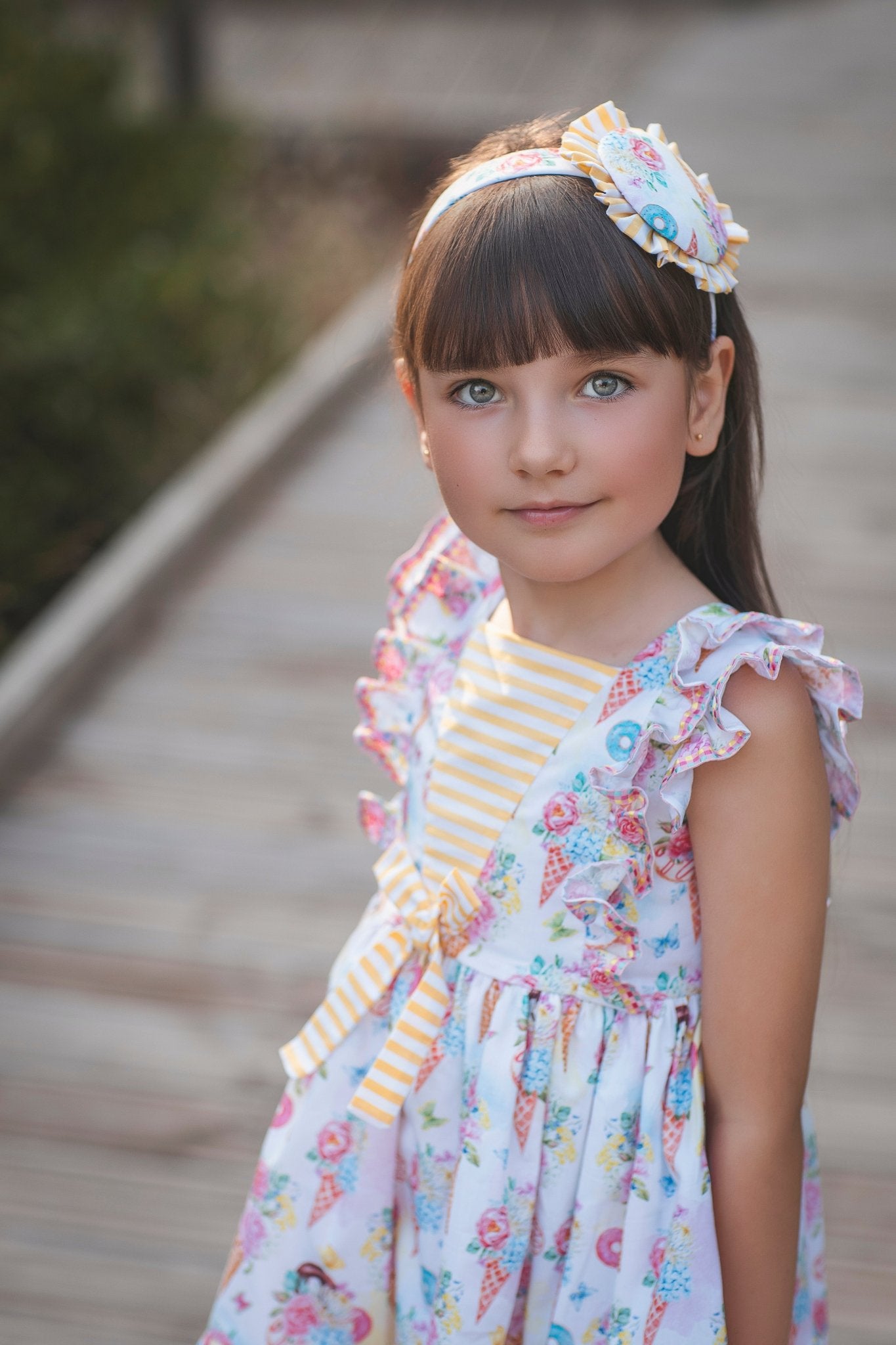 Young girl in Rochy SS26 Sweet Colletion Multicolour dress.
