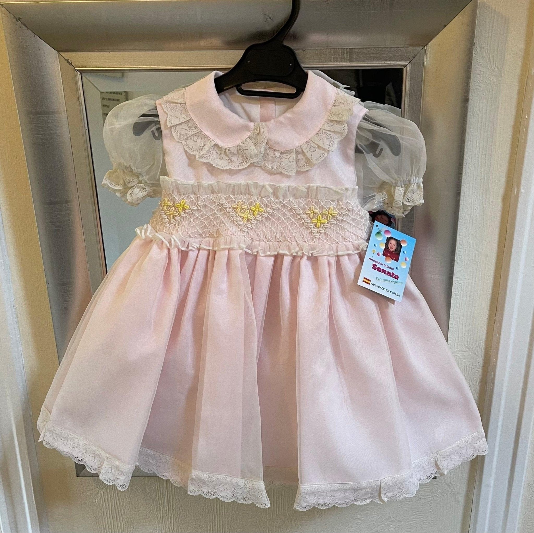 Sonata Girls pink, cream, and lemon smocked dress handmade in Spain