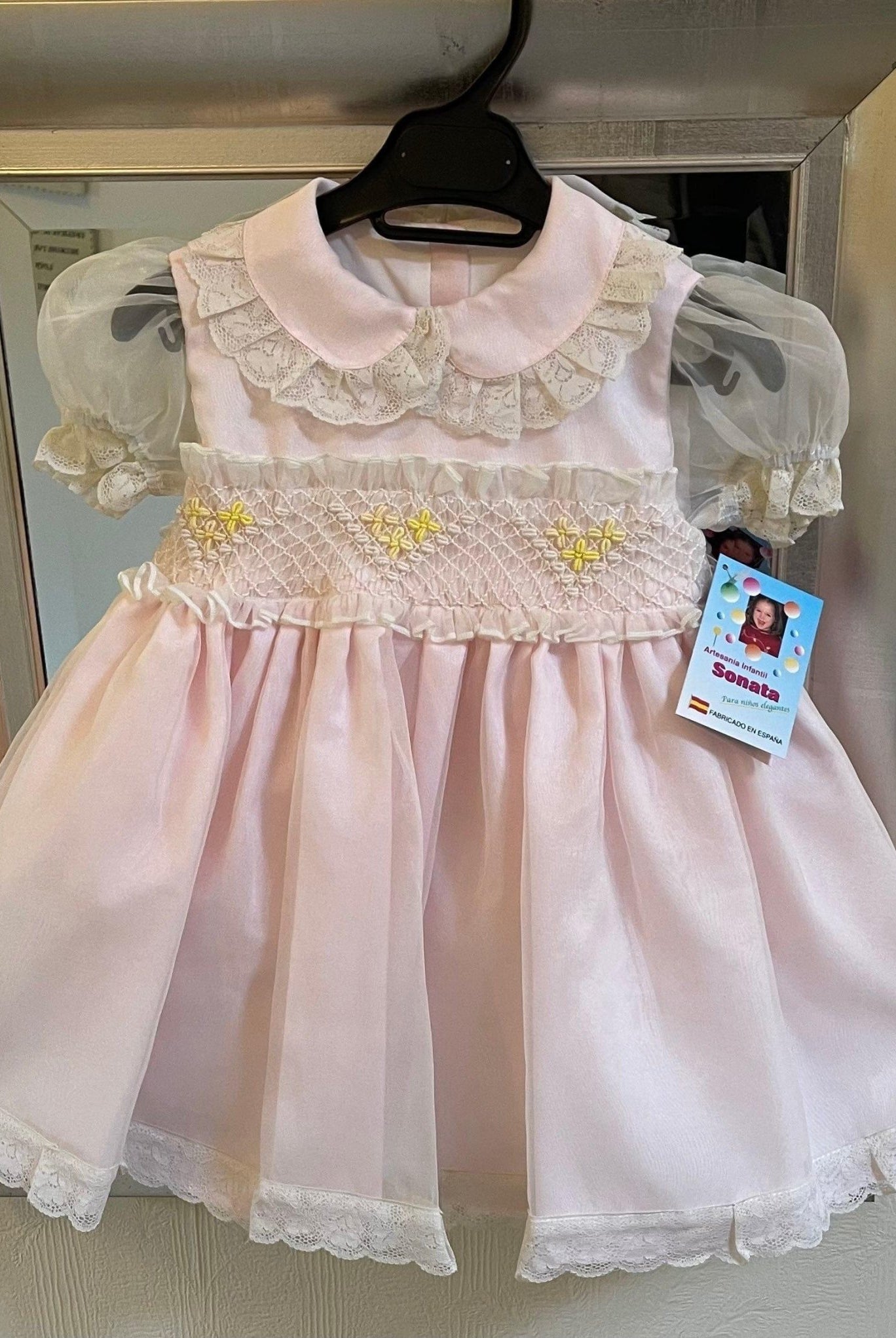 Sonata Girls pink, cream, and lemon smocked dress handmade in Spain