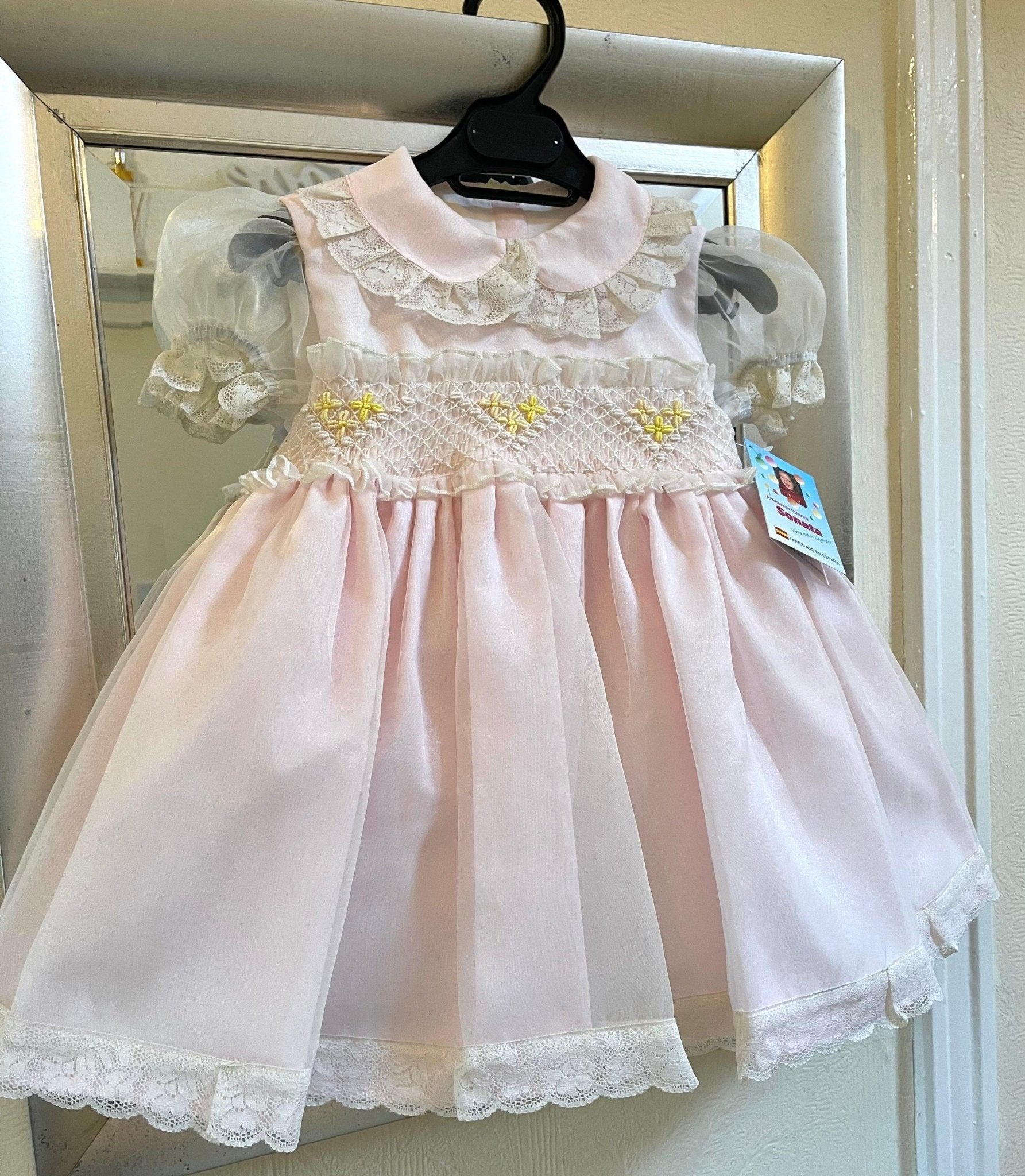 Sonata Girl's pink, cream, and lemon smocked dress handmade in Spain