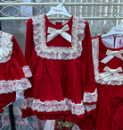 Girls red and cream dress by Debesos.  Perfect for Christmas.