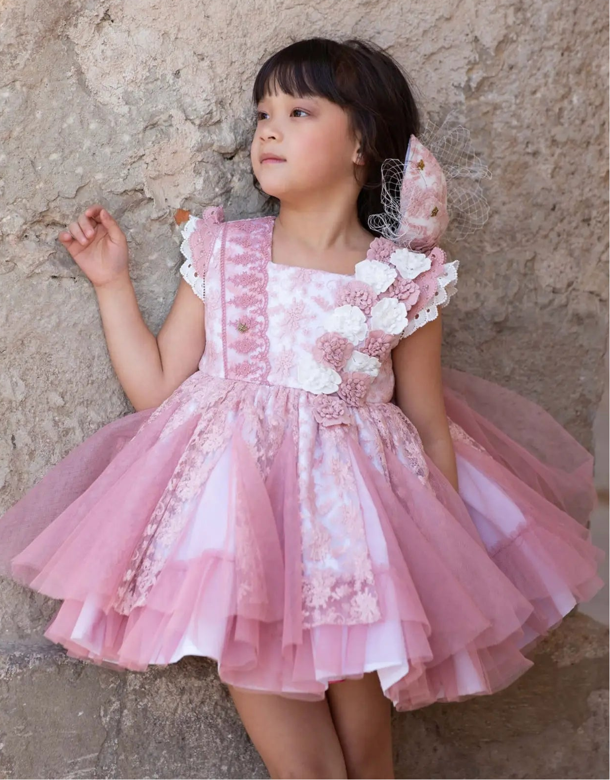 Young girl wearing Meriche SS26 Cream and Dusky Pink Occasion Dress
