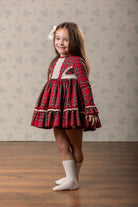 Abuela Tata girls red tartan Christmas dress with ivory lace and matching tartan headpiece AW26. 