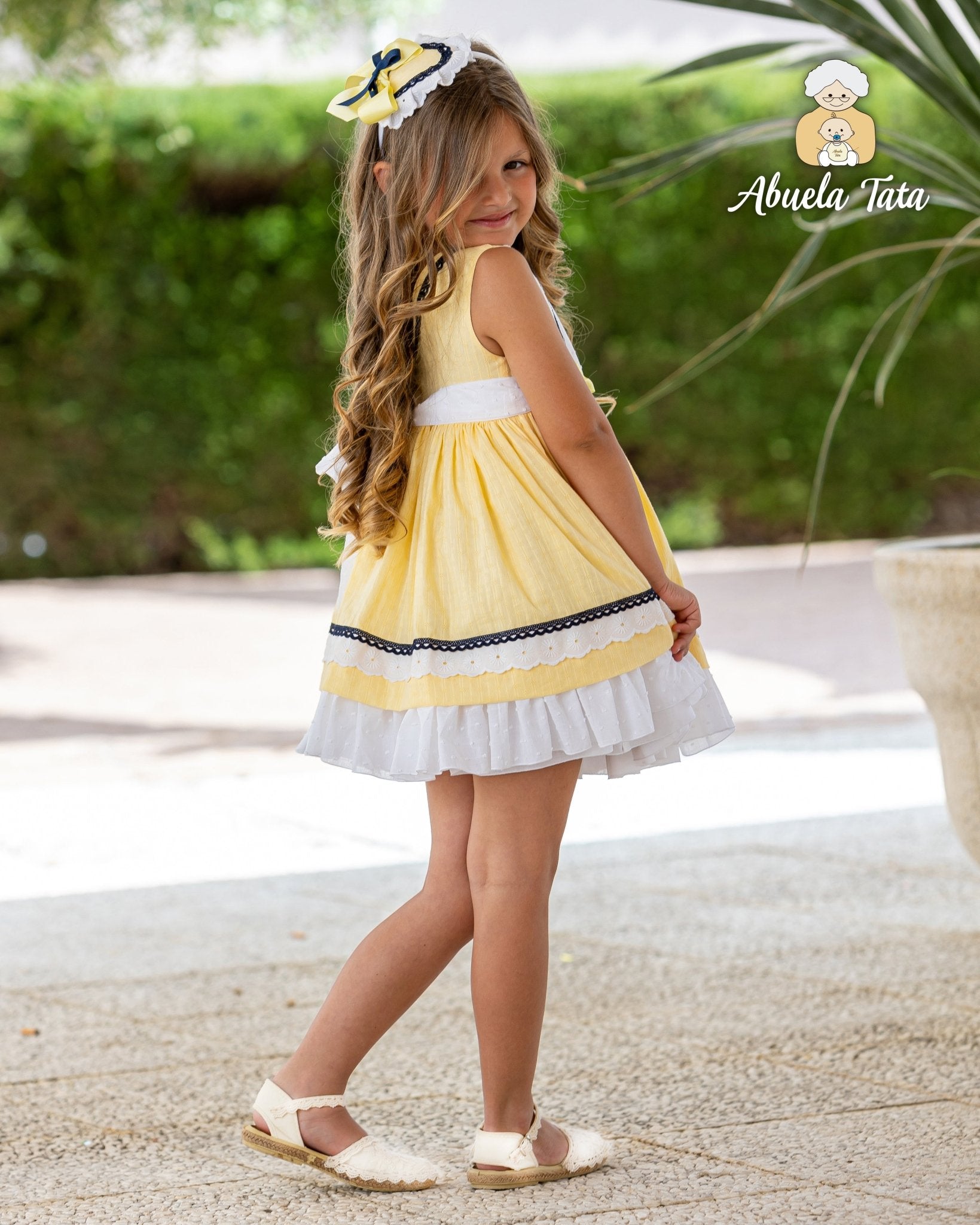 Girls Spanish yellow summer dress with navy trim and headpiece