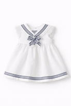 White dress with navy blue stripes and bow on a white background