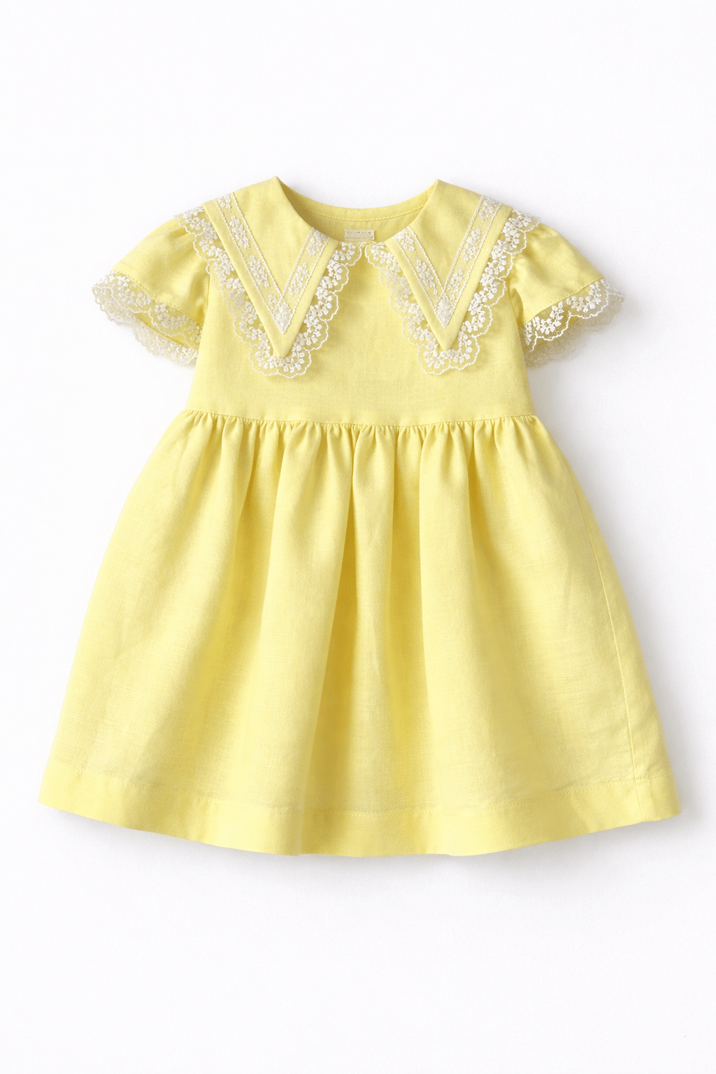 Basmarti SS26 baby girls yellow lace dress in linen and cotton, Spanish children's wear Easter and summer outfit for babies 6–24 months.