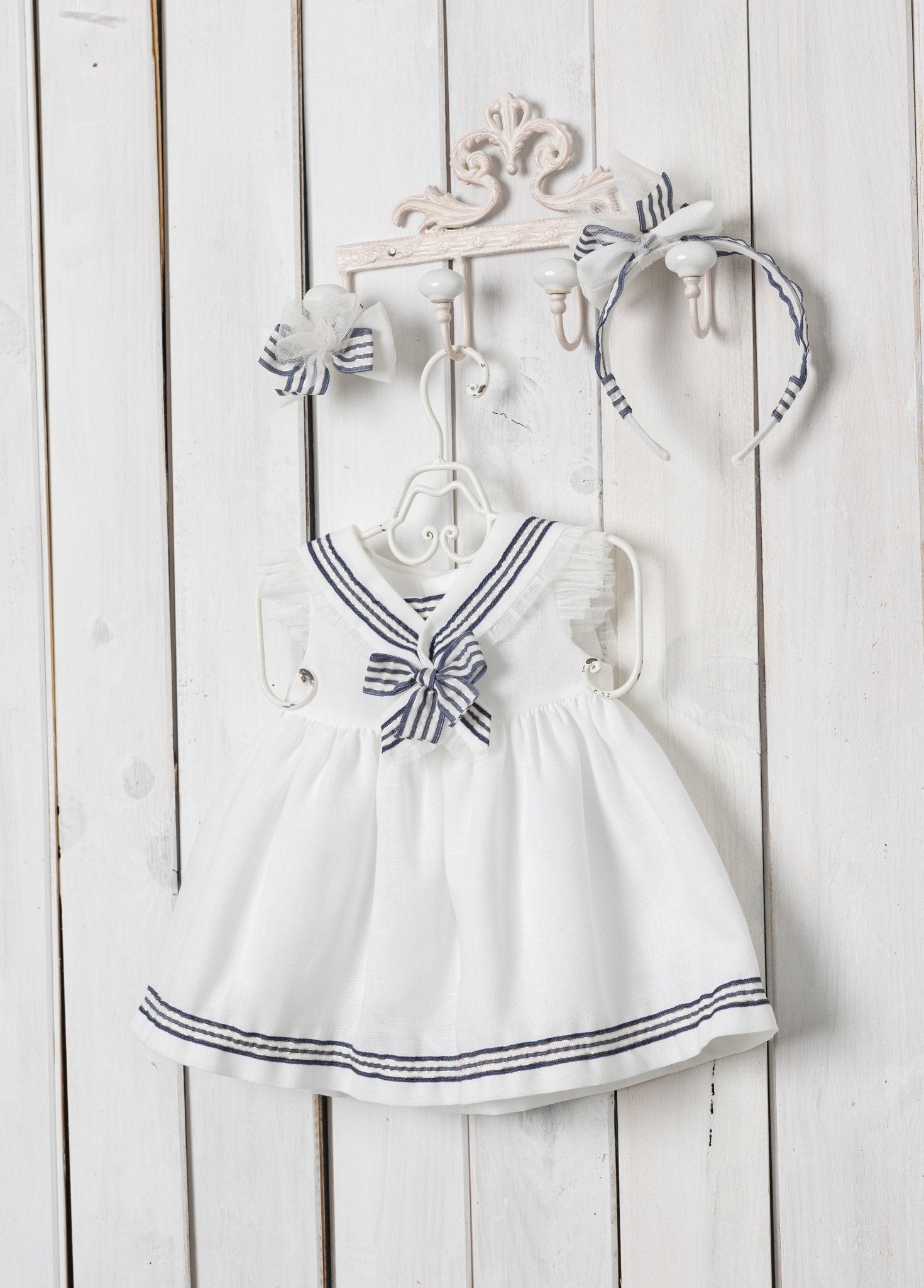 White sailor collar with navy trim on Basmarti baby dress