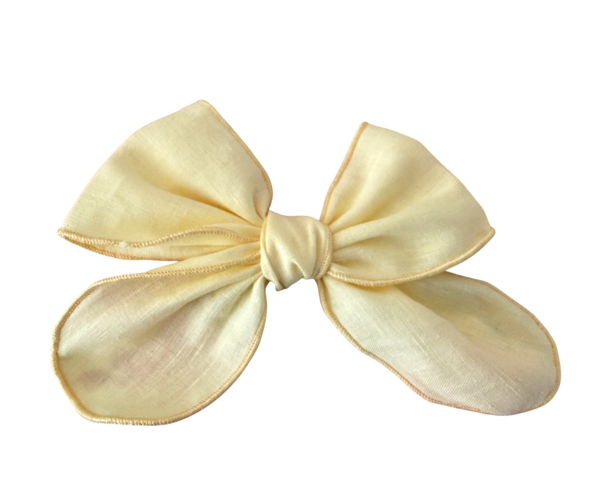 Lemon yellow girls hair bow accessory, perfect for Spanish children's outfits and summer occasion wear.