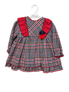 Plaid baby dress with red accents on a white background