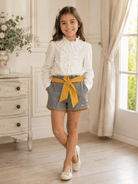 Nekenia cream blouse with matching grey and mustard shorts for girls. 