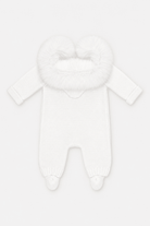A white knit baby footed jumpsuit with a fluffy faux-fur hood, shown against a plain white background.