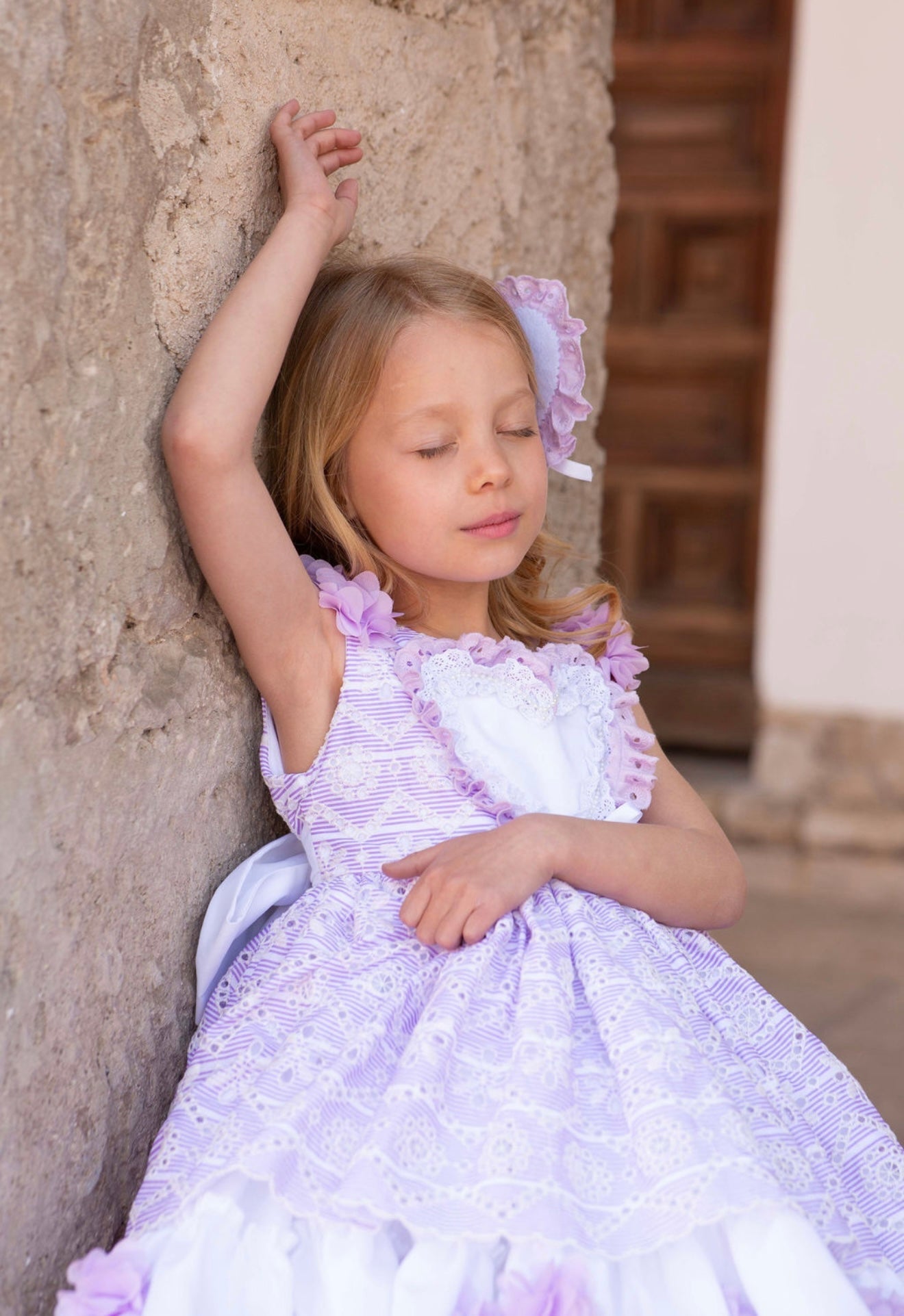 Meriche Alta Costura SS26 girls lilac heart dress with matching headpiece and layered skirt. Luxury Spanish Children's Wear. 
