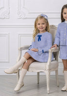 young girl wearing Miranda AW26 blue tweed dress 