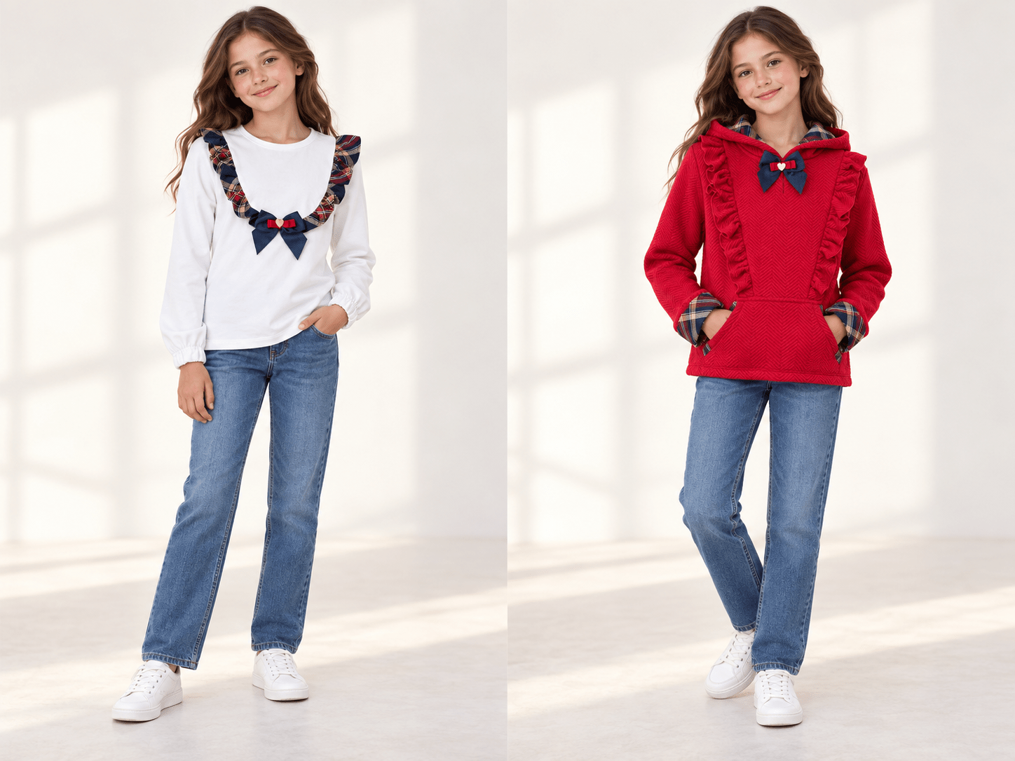 Two young girls modeling coordinated outfits in a bright indoor studio setting. The left girl wears a white long-sleeve top with a colorful plaid bow detail across the chest, blue jeans, and white sneakers.