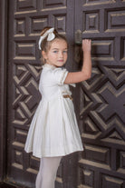 Designer girls special occasion outfit by Naxos with Chanel-inspired silhouette