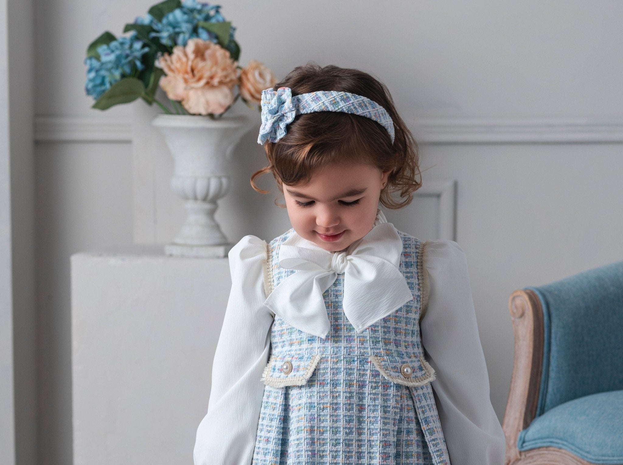 Child wearing Rochy AW25 Chanel Blue Tweed Headpiece to match the Chanel Blue Tweed Dress