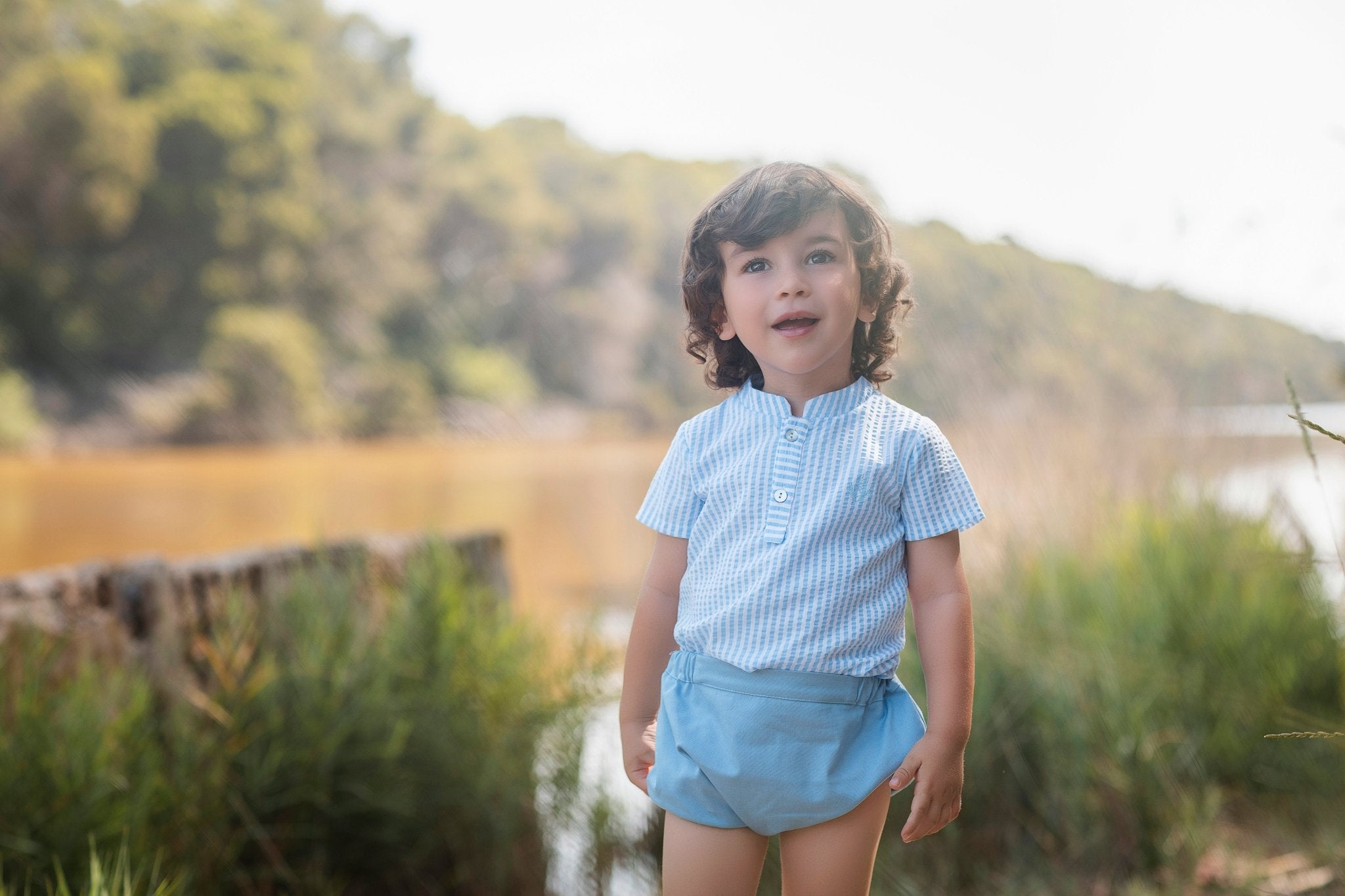 Little boys wearing Rochy SS26 Baby Blue Shorts & Shirt Set. 