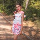 Young girl wearing Rochy SS26 Fluor Neon Collection Shorts & Blouse set. 