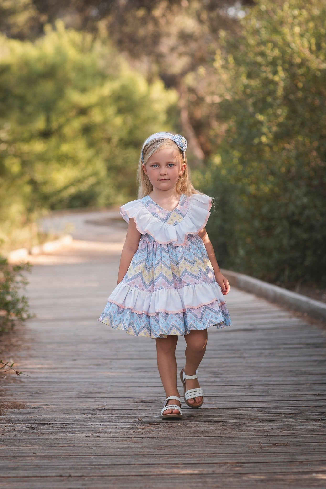 Girl wearing Rochy SS26 Multi Coloured pastel Zig Zag dress