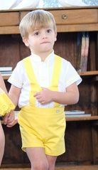Boy wearing yellow H-bar shorts set with cream shirt by Sonata Infantil, Spanish children's outfit UK