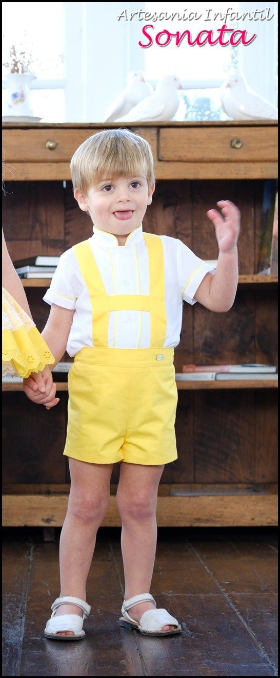 Little Boy wearing yellow H-bar shorts set with cream shirt by Sonata Infantil, Spanish children's outfit UK