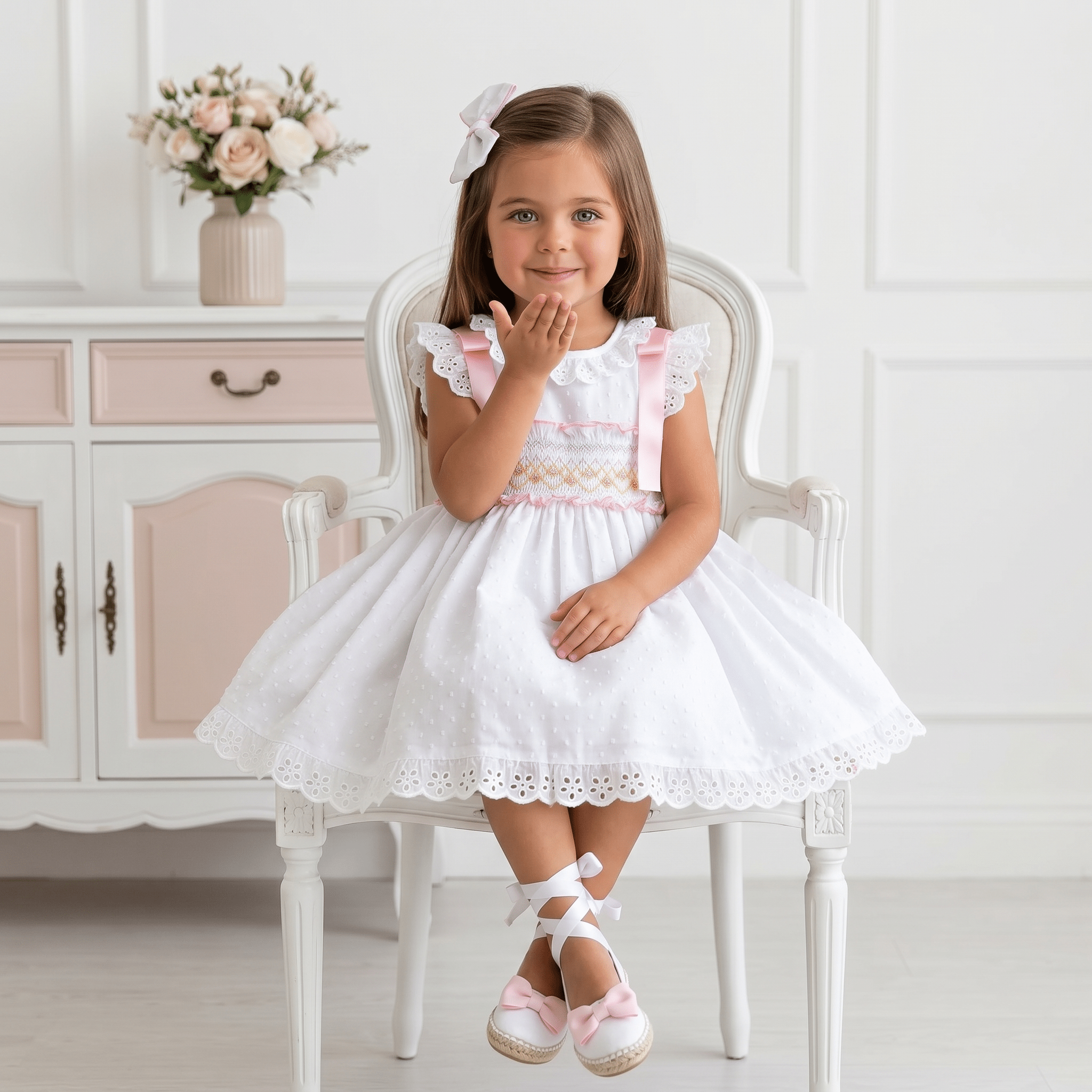 Girls Sonata white smocked Spanish dress with pink ribbon detail, broderie anglaise trims and full skirt