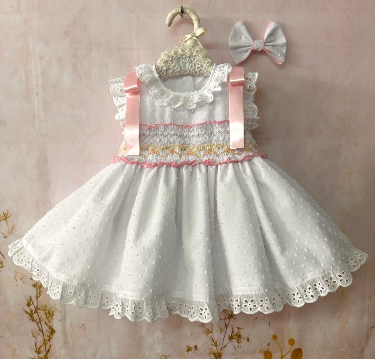 Sonata Girls white  & pink smocked Spanish dress with pink ribbon detail, broderie anglaise trims and full skirt